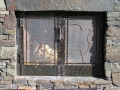 Closeup of outdoor fireplace doors.